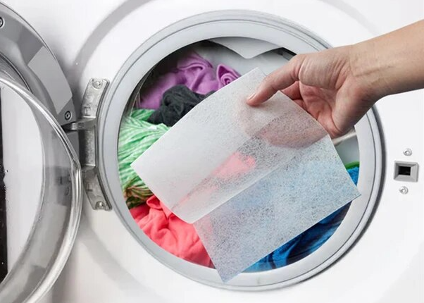 dryer-sheet-being-placed-on-washing-machine